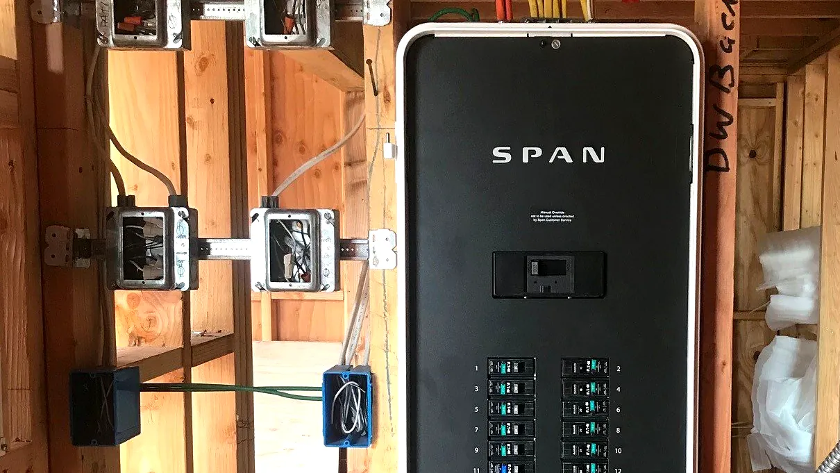 Inside of a residential electrical panel with neatly dressed wiring