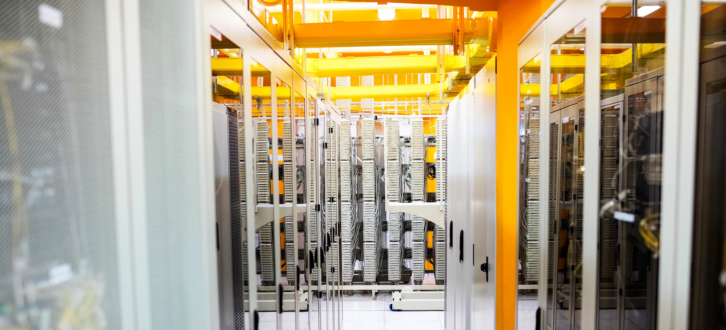 Commercial data center aisle with overhead cable trays